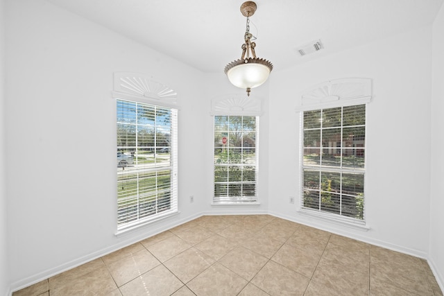 15026 Magnoliabough Pl, Cypress, TX 77429 - unfurnished dining area featuring light tile patterned flooring and baseboards