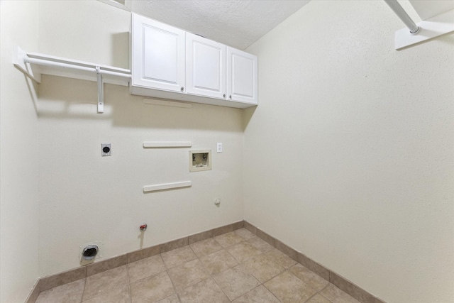 2709 Potomac Dr, League City, TX 77573 - clothes washing area with hookup for a gas dryer, washer hookup, cabinet space, baseboards, and hookup for an electric dryer