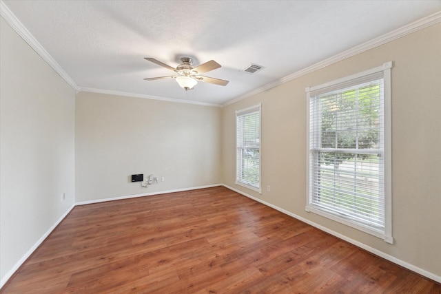 2709 Potomac Dr, League City, TX 77573 - unfurnished room featuring plenty of natural light, wood finished floors, ceiling fan, ornamental molding, and baseboards