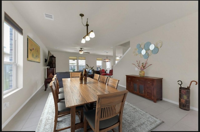 5335 Ivory Glass Dr, Katy, TX 77493 - dining space featuring light tile patterned floors, ceiling fan, and baseboards