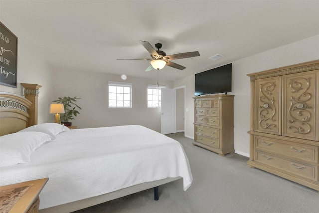 5335 Ivory Glass Dr, Katy, TX 77493 - bedroom with light colored carpet, a ceiling fan, and baseboards