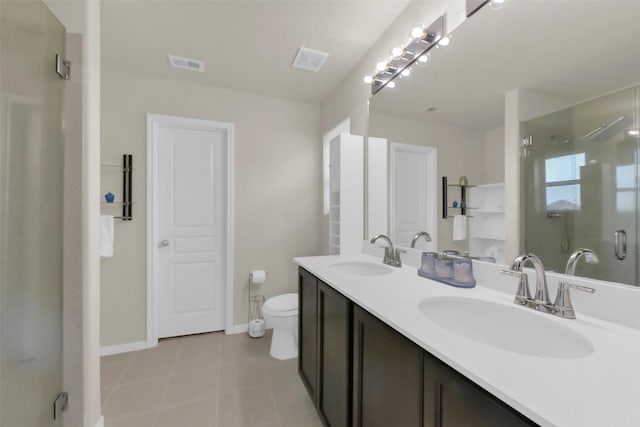 5335 Ivory Glass Dr, Katy, TX 77493 - full bath with tile patterned flooring, a shower stall, toilet, double vanity, and baseboards