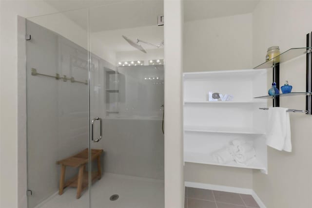 5335 Ivory Glass Dr, Katy, TX 77493 - full bathroom with a stall shower, baseboards, and tile patterned flooring