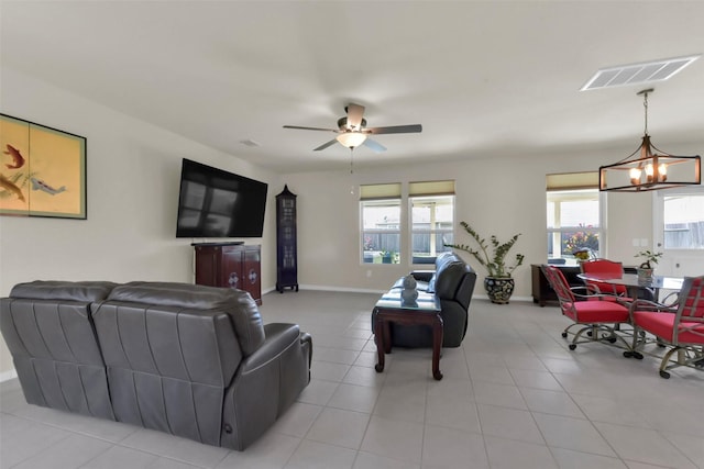 5335 Ivory Glass Dr, Katy, TX 77493 - living room featuring a chandelier, ceiling fan, light tile patterned floors, and baseboards