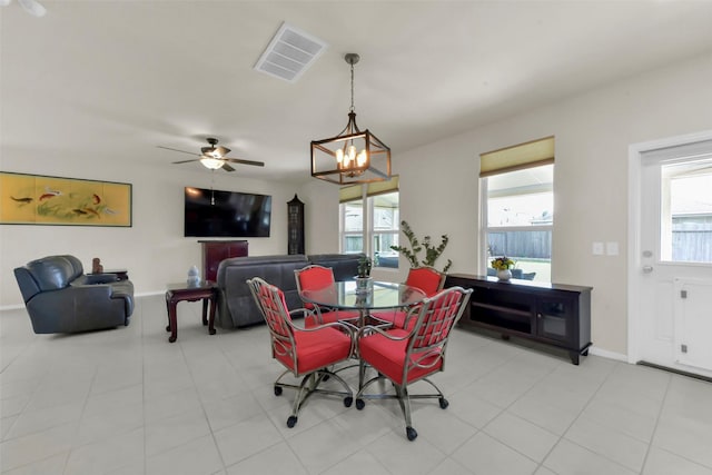 5335 Ivory Glass Dr, Katy, TX 77493 - dining space with a chandelier, a ceiling fan, and baseboards