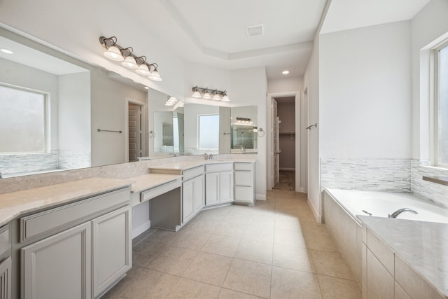 27403 Laurel Bay Ct, Katy, TX 77494 - bathroom with plenty of natural light, vanity, a garden tub, tile patterned floors, and recessed lighting