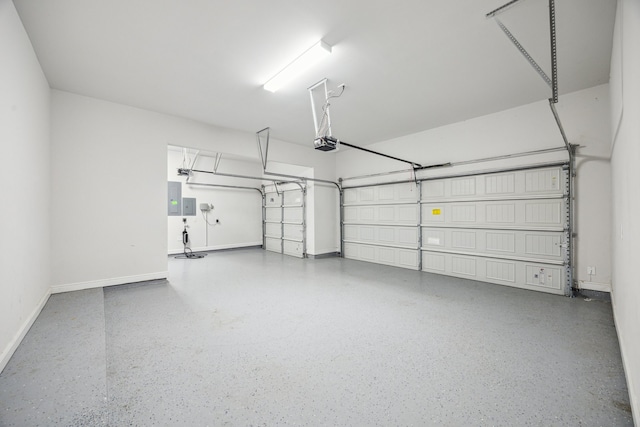 27403 Laurel Bay Ct, Katy, TX 77494 - garage featuring a garage door opener, electric panel, and baseboards
