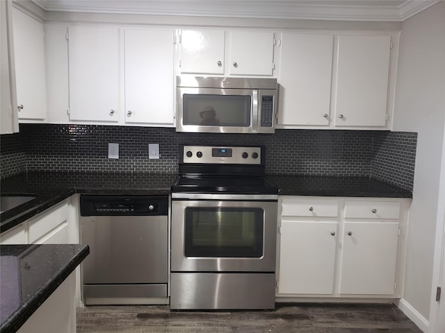 11710 Southlake Dr, Houston, TX 77077 - kitchen with appliances with stainless steel finishes, white cabinets, and dark wood finished floors