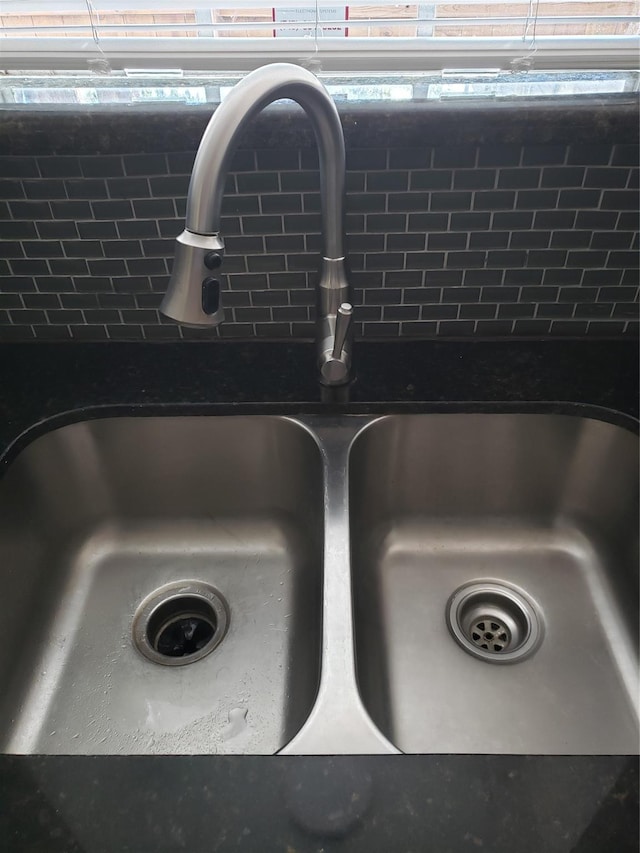 11710 Southlake Dr, Houston, TX 77077 - kitchen view of a sink and dark countertops