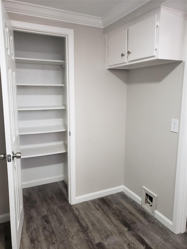 11710 Southlake Dr, Houston, TX 77077 - laundry room featuring dark wood-type flooring, hookup for a washing machine, ornamental molding, cabinet space, and baseboards
