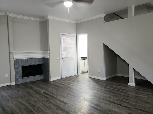 11710 Southlake Dr, Houston, TX 77077 - unfurnished living room with a ceiling fan, crown molding, dark wood-type flooring, baseboards, and a brick fireplace
