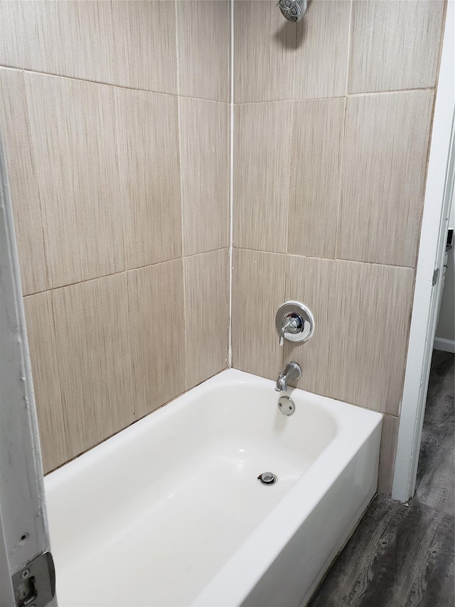 11710 Southlake Dr, Houston, TX 77077 - bathroom with a bath, a shower, and wood finished floors