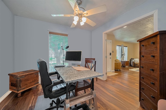 21226 Park Bend Dr, Katy, TX 77450 - office space with wood finished floors, a ceiling fan, and baseboards
