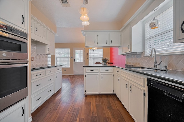 21226 Park Bend Dr, Katy, TX 77450 - kitchen with dishwasher, a sink, stainless steel double oven, and dark countertops