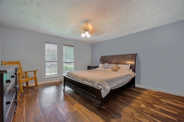 21226 Park Bend Dr, Katy, TX 77450 - bedroom featuring wood finished floors, baseboards, a textured ceiling, and a ceiling fan