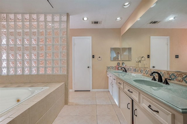 21226 Park Bend Dr, Katy, TX 77450 - full bathroom with a tub with jets, double vanity, tile patterned floors, and recessed lighting