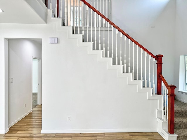 9630 Landry Blvd, Spring, TX 77379 - stairway featuring wood finished floors and baseboards