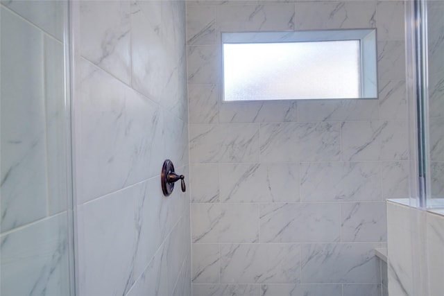 9630 Landry Blvd, Spring, TX 77379 - bathroom with a tile shower and healthy amount of natural light