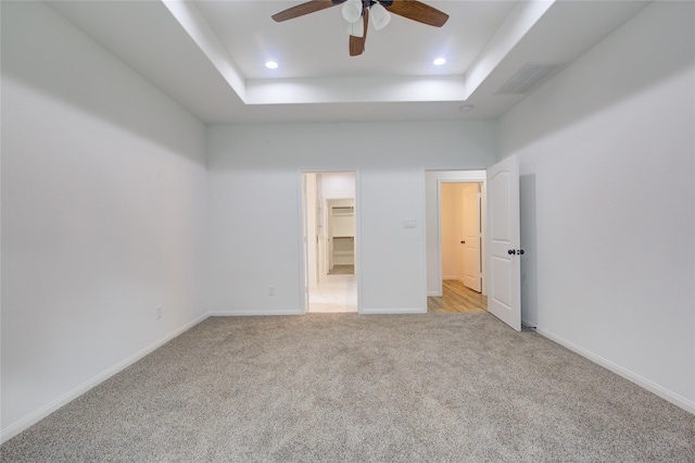 9630 Landry Blvd, Spring, TX 77379 - unfurnished bedroom featuring a raised ceiling, light carpet, recessed lighting, a spacious closet, and baseboards