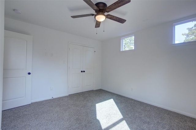 9630 Landry Blvd, Spring, TX 77379 - unfurnished bedroom featuring carpet flooring, baseboards, a closet, and ceiling fan