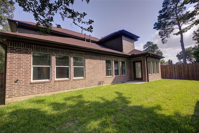 9630 Landry Blvd, Spring, TX 77379 - rear view of property featuring brick siding