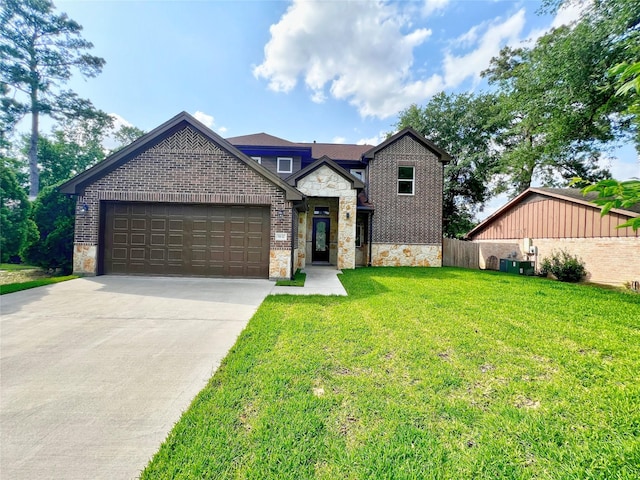 9630 Landry Blvd, Spring, TX 77379 - view of front of property with stone siding, an attached garage, concrete driveway, and brick siding