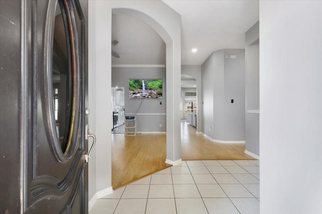 14 Mira Loma Dr, Manvel, TX 77578 - entrance foyer with arched walkways, light tile patterned floors, baseboards, and recessed lighting