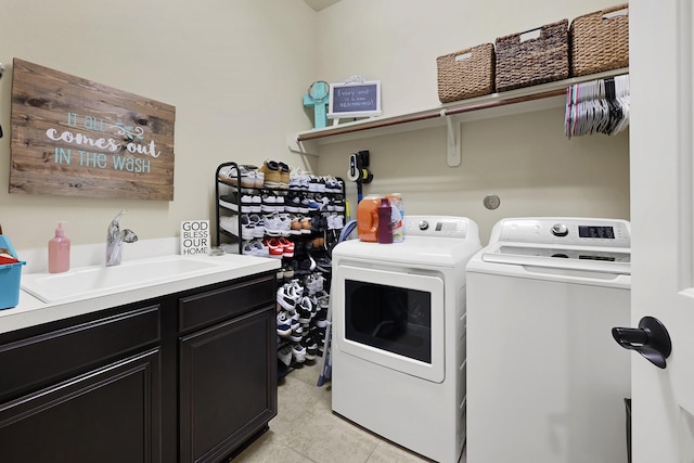 14023 Loramie Creek Ct, Houston, TX 77044 - laundry area featuring washer and clothes dryer and cabinet space