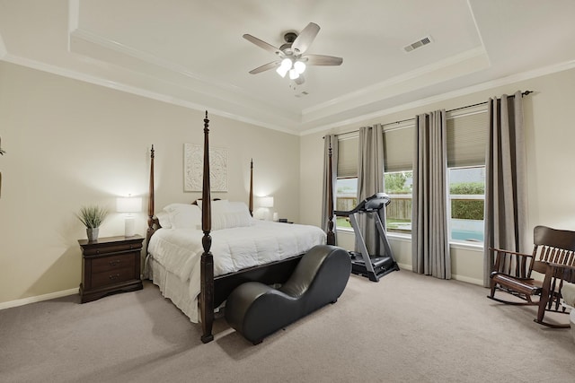 14023 Loramie Creek Ct, Houston, TX 77044 - bedroom with a tray ceiling, light colored carpet, crown molding, and baseboards