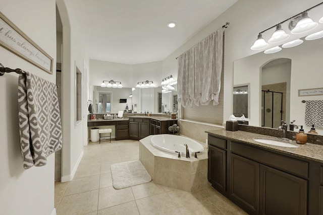 14023 Loramie Creek Ct, Houston, TX 77044 - full bath featuring a shower stall, tile patterned floors, a bath, and two vanities
