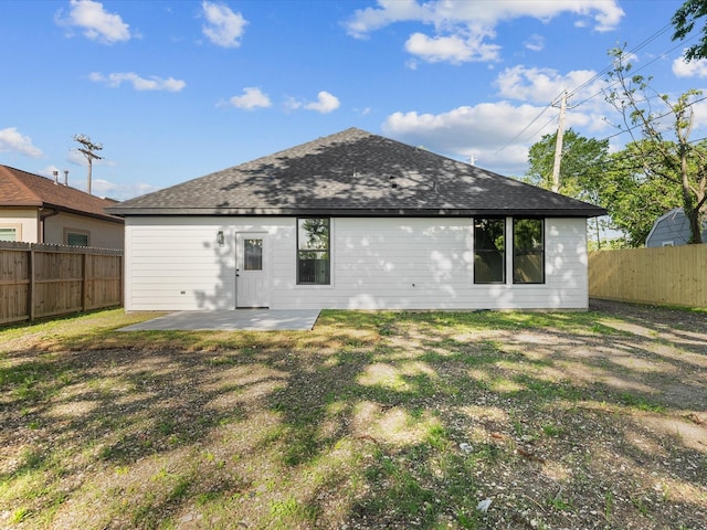 2235 Minnesota St, Houston, TX 77034 - back of property with a patio, a fenced backyard, and a shingled roof