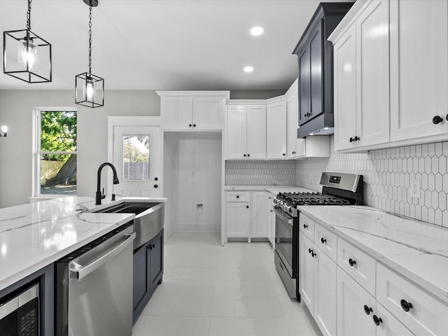 2235 Minnesota St, Houston, TX 77034 - kitchen with appliances with stainless steel finishes, a sink, tasteful backsplash, decorative light fixtures, and recessed lighting