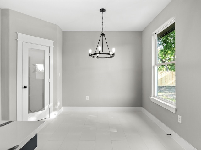 2235 Minnesota St, Houston, TX 77034 - unfurnished dining area featuring a chandelier, healthy amount of natural light, and baseboards