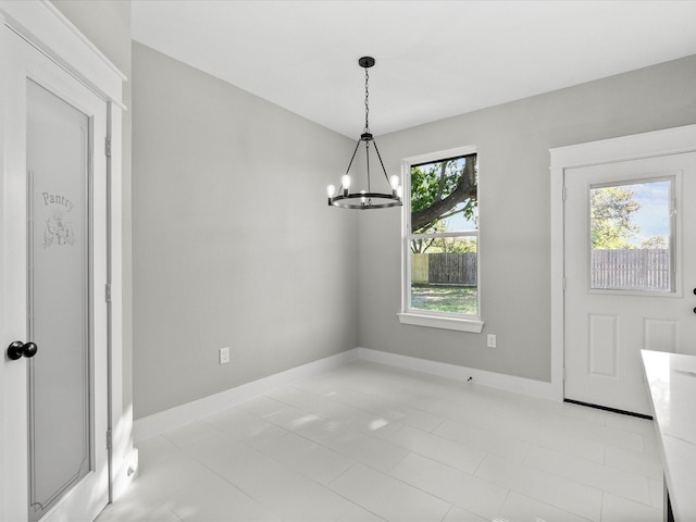 2235 Minnesota St, Houston, TX 77034 - unfurnished dining area with a chandelier and baseboards