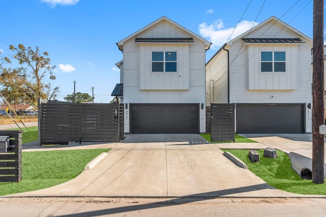 8514 W St, Houston, TX 77093 - view of front facade with a garage, board and batten siding, driveway, and a standing seam roof
