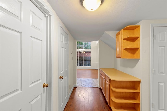 14306 Medlowe Ct, Cypress, TX 77429 - hallway featuring dark wood-style flooring, a textured ceiling, and baseboards