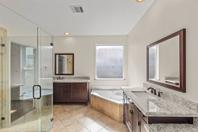 14306 Medlowe Ct, Cypress, TX 77429 - bathroom featuring a shower stall, a jetted tub, two vanities, and tile patterned floors
