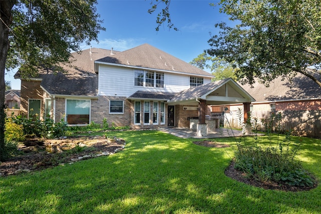 14306 Medlowe Ct, Cypress, TX 77429 - back of property with a patio, a lawn, and brick siding