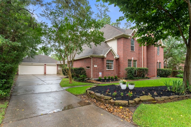 6 Cranberry Bnd, The Woodlands, TX 77381 - traditional-style house with brick siding, roof with shingles, a front lawn, a garage, and concrete driveway