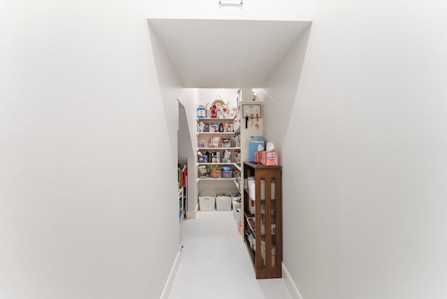 6 Cranberry Bnd, The Woodlands, TX 77381 - hallway featuring baseboards and light tile patterned flooring