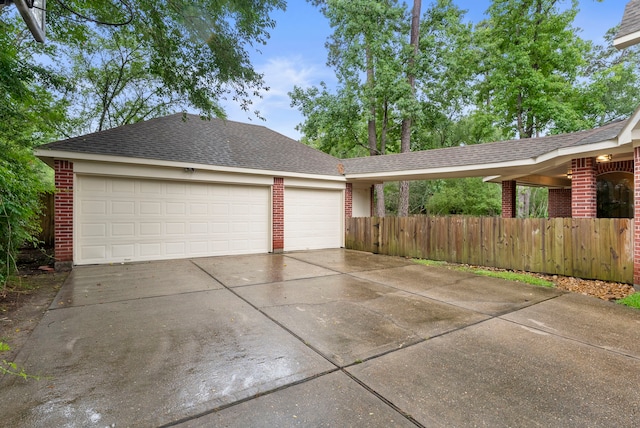 6 Cranberry Bnd, The Woodlands, TX 77381 - view of front of house with brick siding, a garage, driveway, and a shingled roof