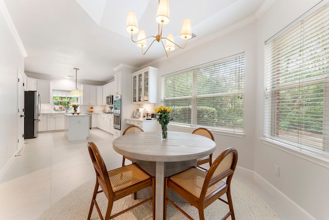 6 Cranberry Bnd, The Woodlands, TX 77381 - dining space featuring ornamental molding, baseboards, a chandelier, and light tile patterned floors