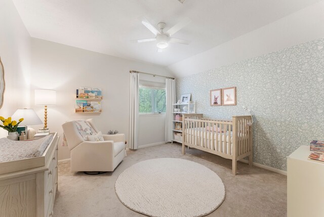 6 Cranberry Bnd, The Woodlands, TX 77381 - bedroom with a nursery area, light carpet, vaulted ceiling, wallpapered walls, and baseboards