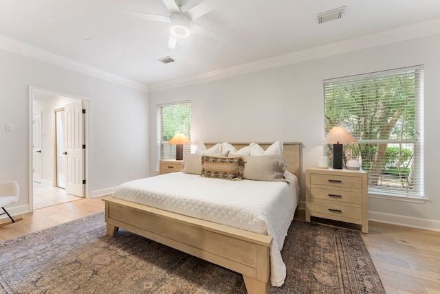 6 Cranberry Bnd, The Woodlands, TX 77381 - bedroom with ornamental molding, light wood-style floors, baseboards, and ceiling fan
