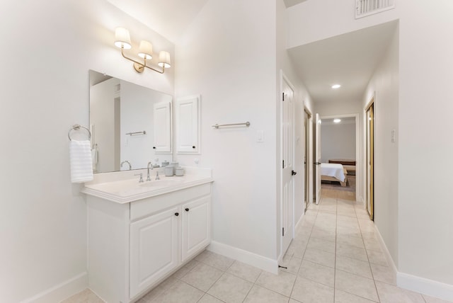 6 Cranberry Bnd, The Woodlands, TX 77381 - bathroom with vanity, tile patterned flooring, baseboards, and connected bathroom
