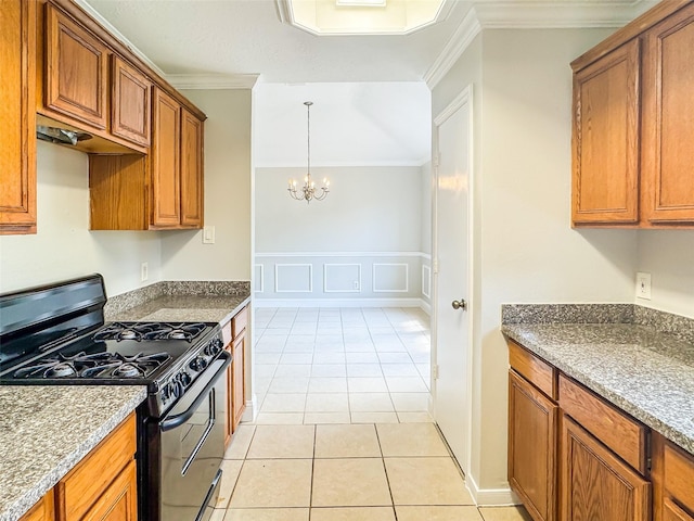 5422 Quail Cove Ln, Houston, TX 77053 - kitchen with black gas range oven, ornamental molding, brown cabinets, and a chandelier