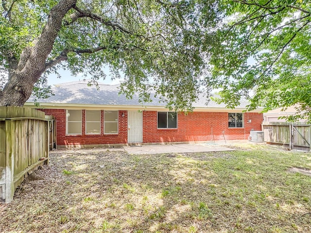 5422 Quail Cove Ln, Houston, TX 77053 - rear view of house with brick siding, a patio area, a fenced backyard, and cooling unit