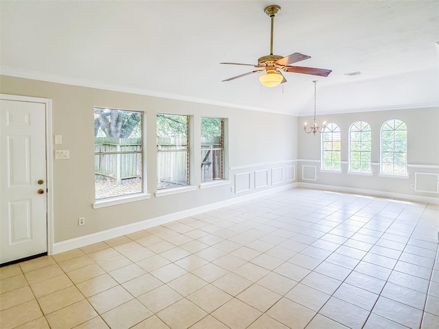5422 Quail Cove Ln, Houston, TX 77053 - empty room with ornamental molding, ceiling fan, a chandelier, light tile patterned floors, and a wainscoted wall
