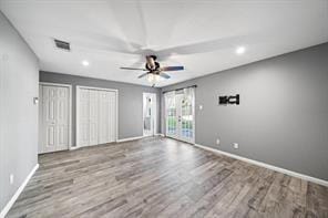 9638 Ravensworth Dr, Houston, TX 77031 - unfurnished living room with wood finished floors, baseboards, ceiling fan, and recessed lighting