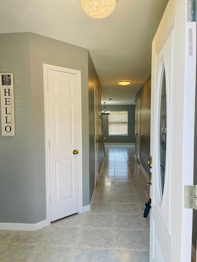 5530 Imperial Grove Dr, Houston, TX 77066 - hall with baseboards and light tile patterned floors